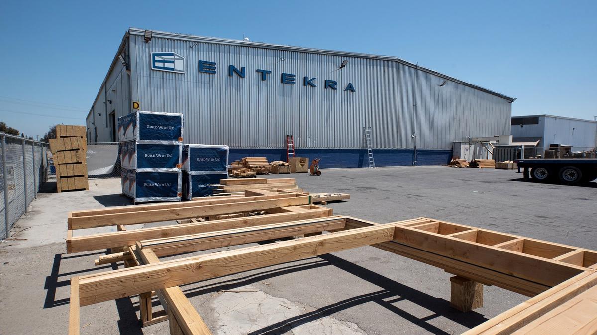 Walls of a residential home are stacked in preparation for shipment at the Entekra manufacturing facility in Ripon, Calif., Thursday, May 24, 2018.