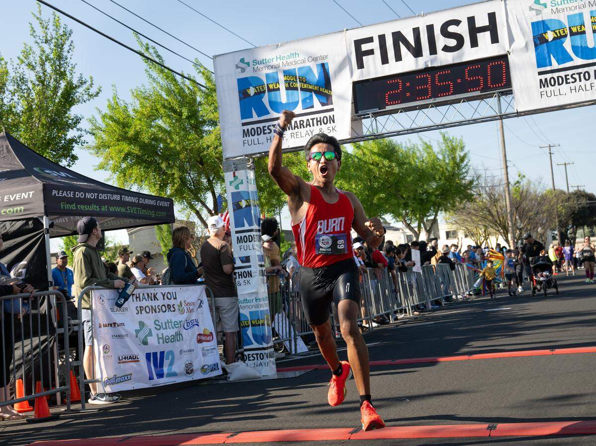 Lupe Palalia crosses the finish line to win the marathon with a time of 2:35.49.