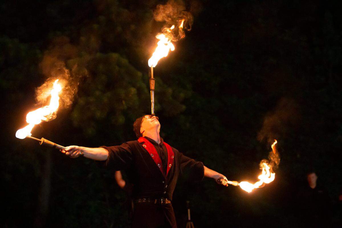 Kevin Axtell, professional fire juggler, eater and walker, performs at the 2018 All Hallows Fantasy Faire.