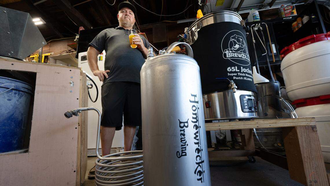 Henry VanderWeide III puts his finished beer into a small keg at his home in Ripon, Calif., Friday, August 18, 2023.