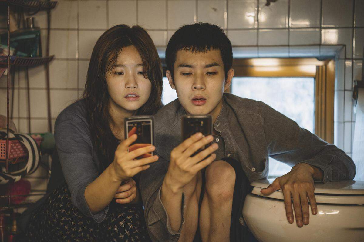 So-dam Park, left, and Woo-sik Choi in a scene from “Parasite.”