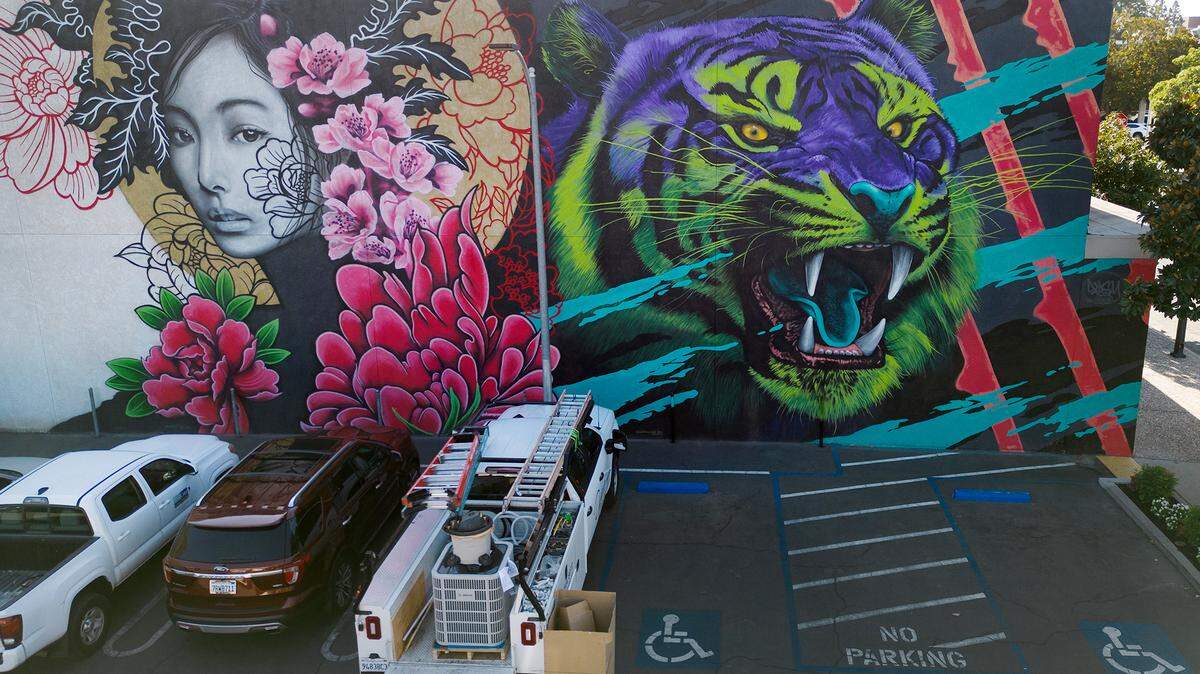 A mural on 12th Street by Shane Grammer was completed during the DoMo Walls mural festival in 2022. Photographed in Modesto, Calif., Thursday, Sept. 28, 2023. 