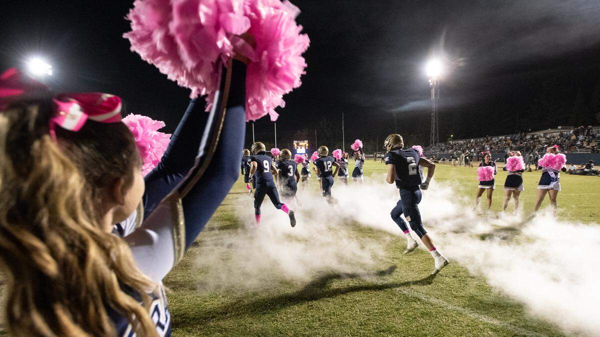 Central Catholic players take the field before the Valley Oak League game with Manteca at Central Catholic High School in Modesto, Calif., on Friday, Oct. 15, 2021.