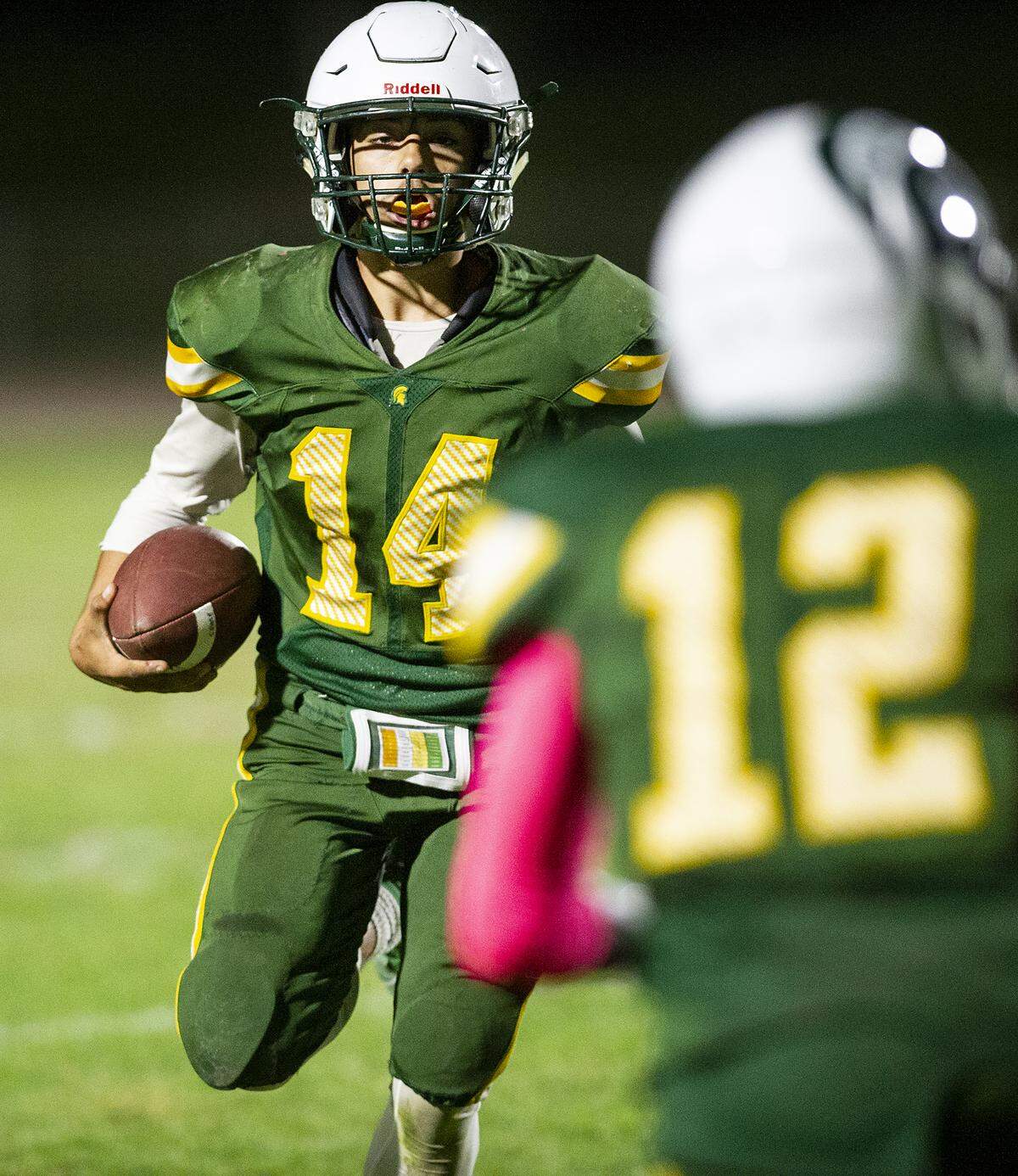 Davis quarterback Elijah Diaz runs the ball during the Western athletic Conference game with Beyer at Gregori High School in Salida, Calif., Thursday, Oct. 17, 2019.