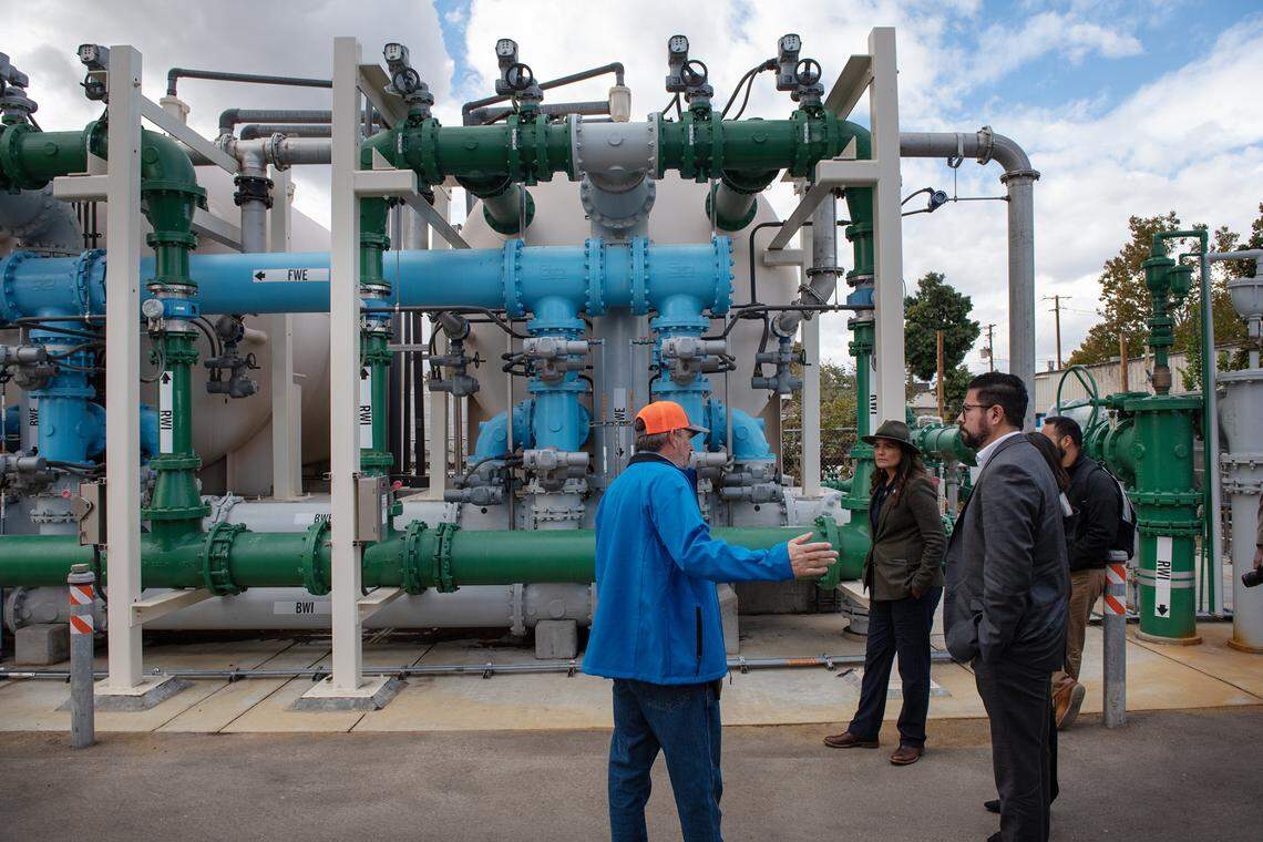 Officials from state and federal Environmental Protection Agencies tour the water treatment plant in Keyes, Calif., Wednesday, Nov. 2, 2022. The drinking water system for Keyes is getting $20.4 million from the federal infrastructure bill for water treatment projects.