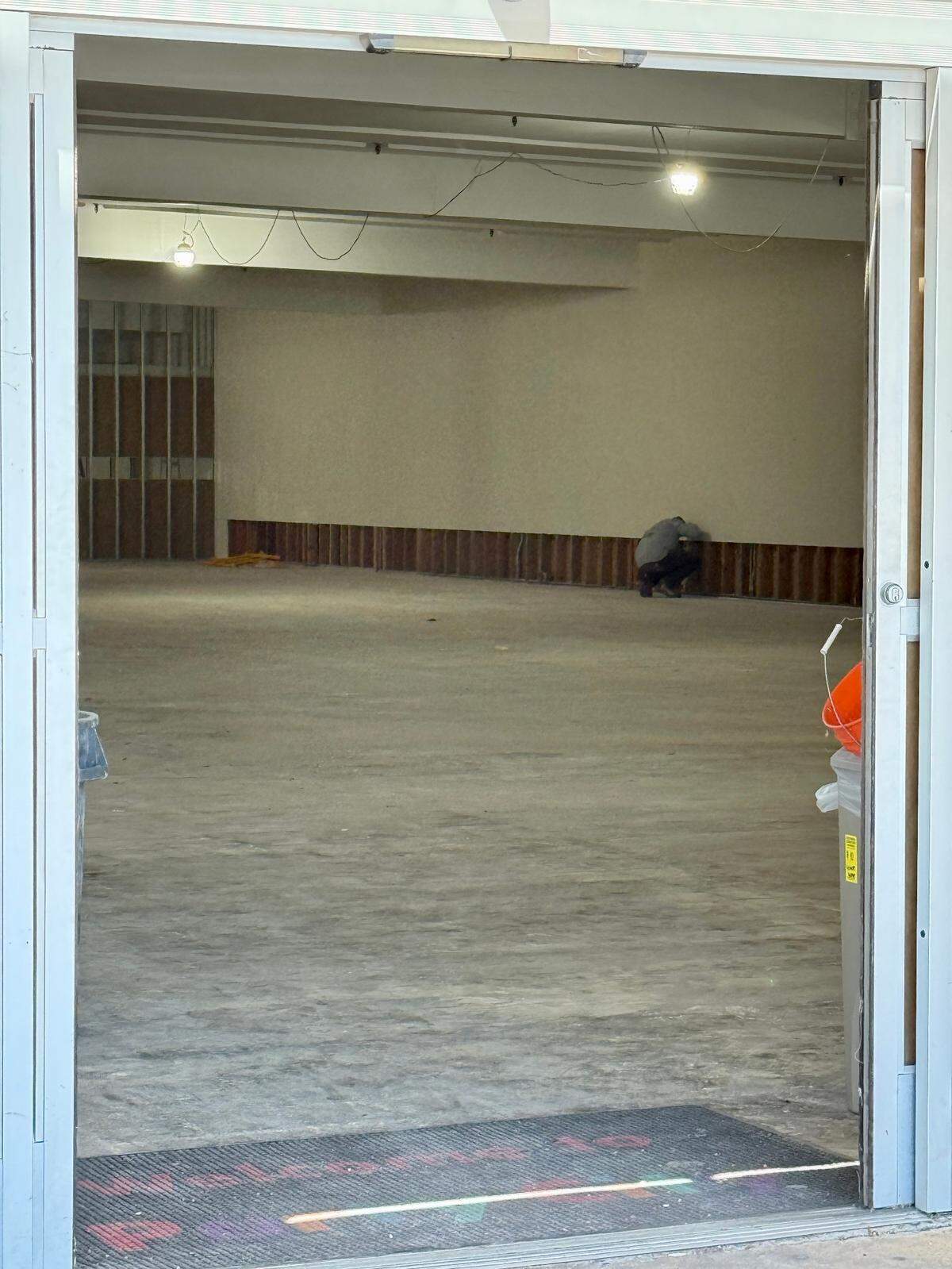Construction workers prepare the former Party City site on July 21, 2025, on McHenry Avenue in Modesto, Calif., for a new Five Below store.