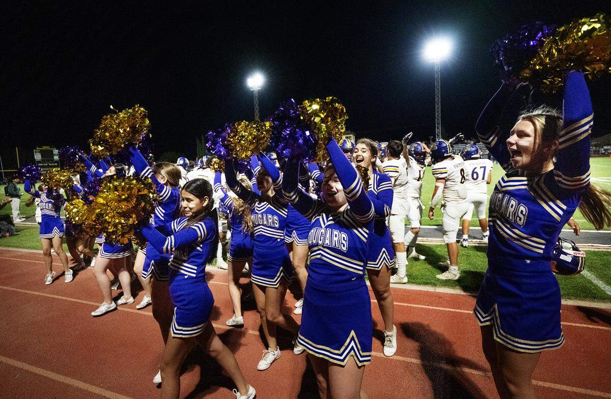 Escalon cheer squad and players celebrate after the 21-14 victory over Hughson at Hughson High School in Hughson, Calif., Friday, Sept. 29, 2023.