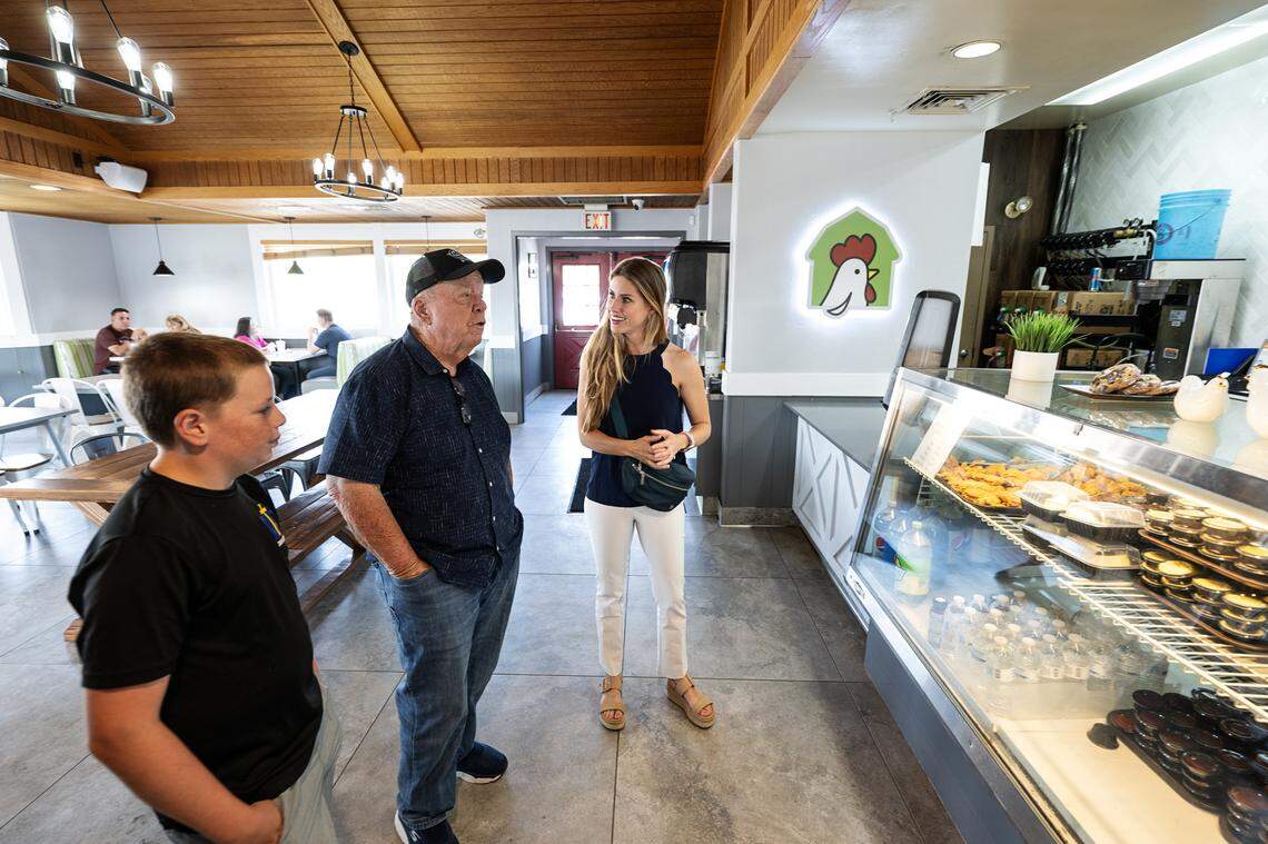 Owner Madison Cory, right, talks with customer Rick Van Unen and his grandson Ethan Mendes at Chicken Barn restaurant in Modesto, Calif., Thursday, Sept. 21, 2023.