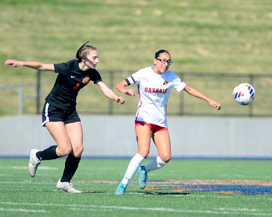 Oakdale’s Jocelyn Gradilla (7) races to the ball against a Roseville defender during the Sac-Joaquin Section Division III Championship between Oakdale High School and Roseville High School at Cosumnes River College in Sacramento, Calif. on Saturday, March 1, 2025.
