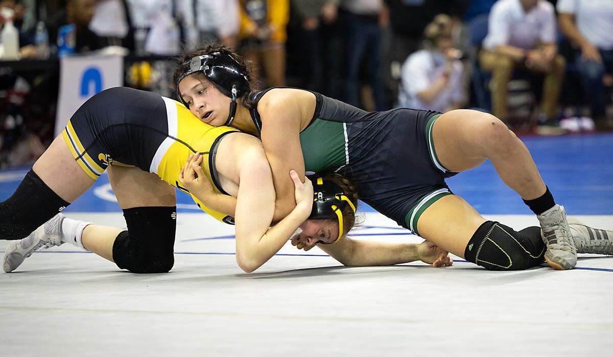 Pitman’s Lillian Avalos, right, wrestles Elena Ivaldi of Del Oro in the 121-pound championship match during the CIF Sac-Joaquin Section Masters Wrestling Tournament at the Stockton Arena in Stockton, Calif., on Saturday, Feb. 19, 2022. Ivaldi took first with a 4-0 victory.
