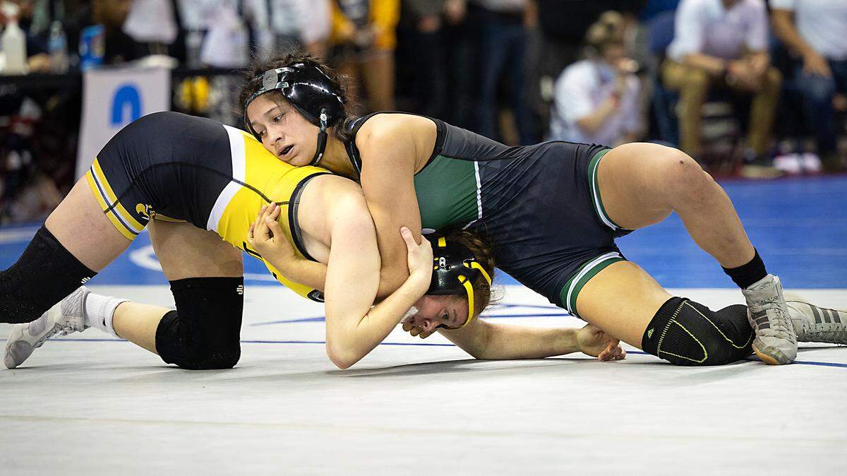 Pitman’s Lillian Avalos, right, wrestles Elena Ivaldi of Del Oro in the 121-pound championship match during the CIF Sac-Joaquin Section Masters Wrestling Tournament at the Stockton Arena in Stockton, Calif., on Saturday, Feb. 19, 2022. Ivaldi took first with a 4-0 victory.