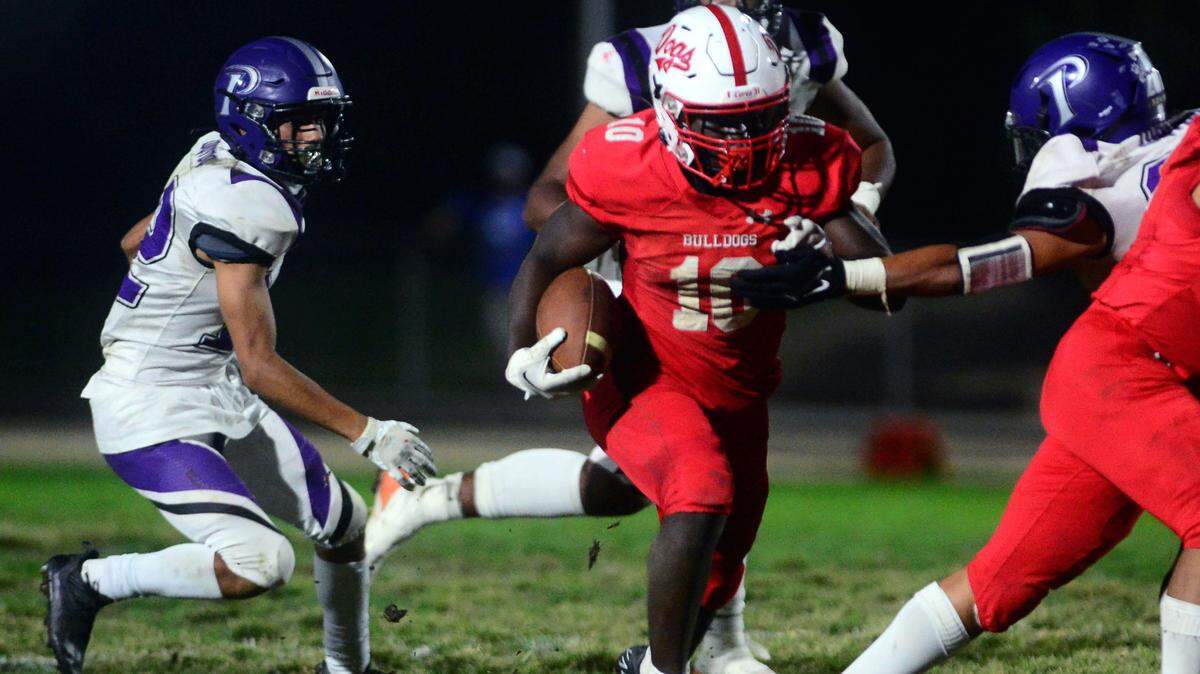 Ceres running back Tarrell Lee-Gill runs though the Pacheco defense during a game between Ceres High School and Pacheco High School at Ceres High School in Ceres California on October 7, 2022.
