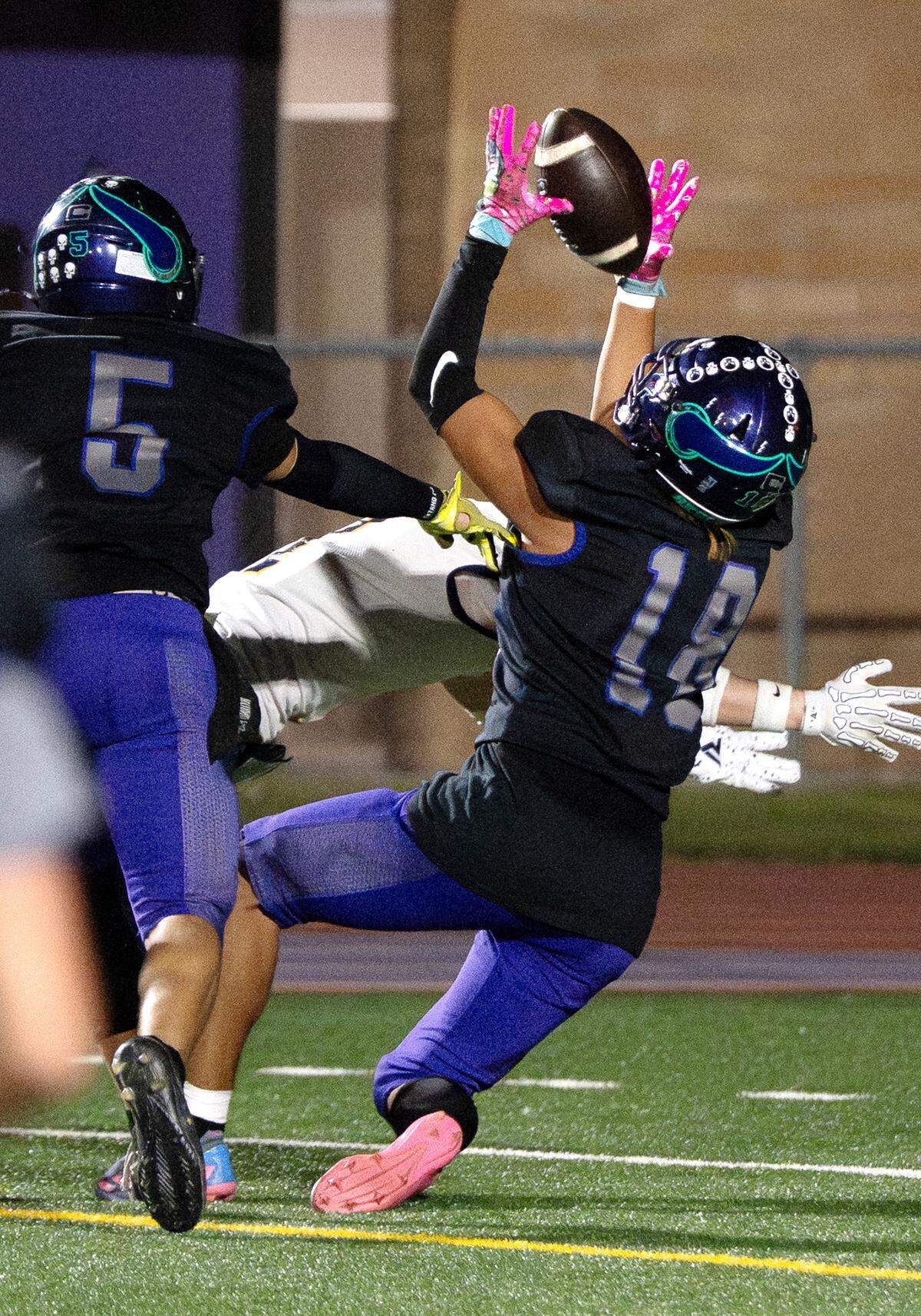 Johansen’s Jeydan Saing makes an interception in the end zone during the Sac-Joaquin Section Championship Bowl game with Gregori at Johansen High School in Modesto on Friday, Nov. 7, 2025.