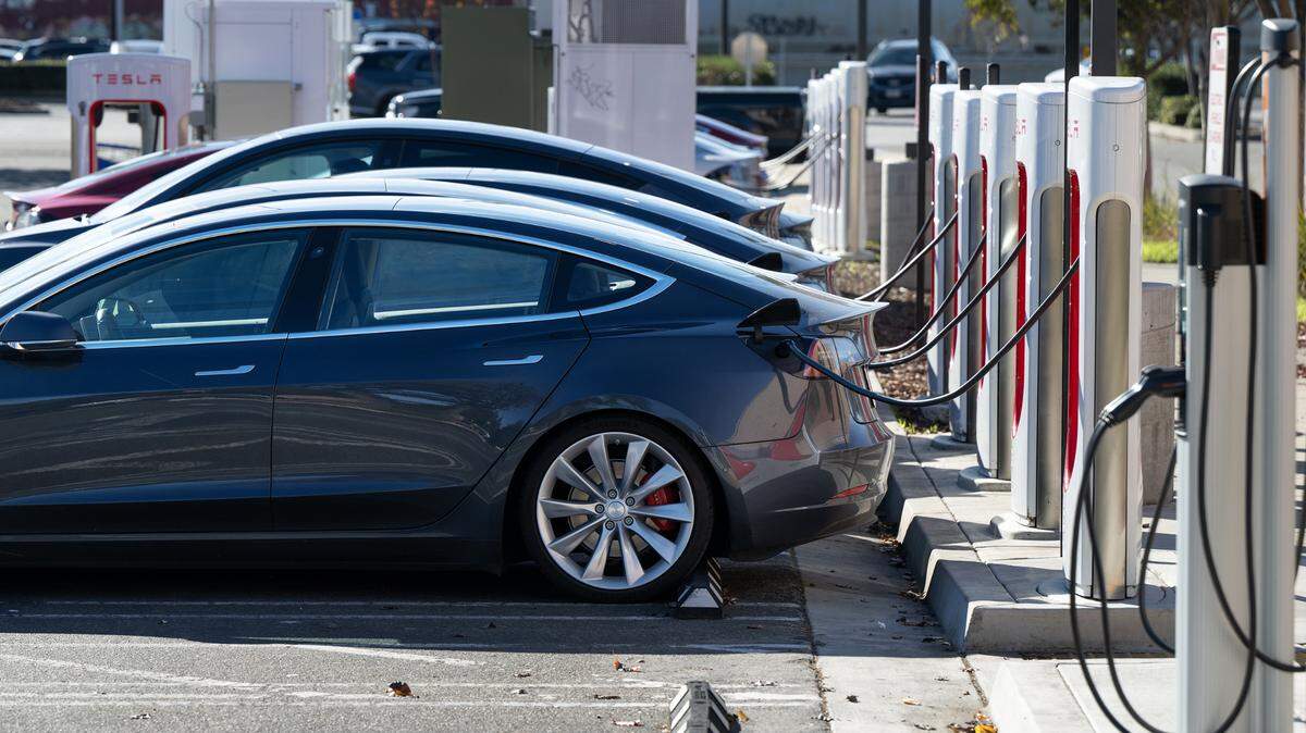 Teslas charge in Modesto in January. Electric vehicle owners pay no gas taxes that have long funded state and local transportation needs.