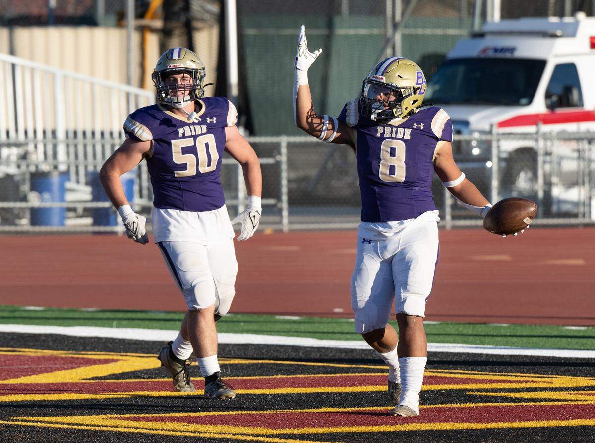 Bradshaw Christian’s Mateo Mojica celebrates a rushing touchdown with teammate Miles McFarland during the Sac-Joaquin Section Division VI championship game with Hughson at Sacramento City College in Sacramento, Calif., Saturday, Nov. 25, 2023.