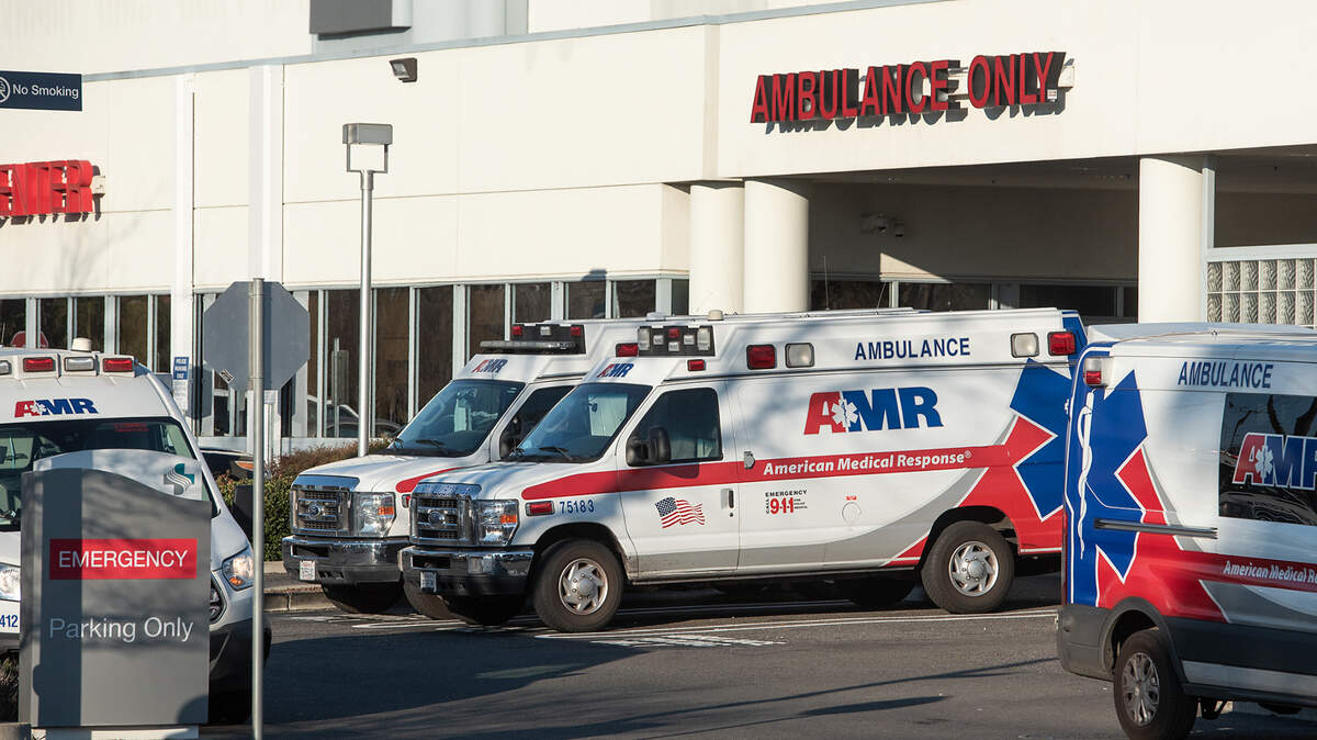 AMR ambulances are parked outside the emergency department at Sutter Memorial Medical Center in Modesto in January 2022.