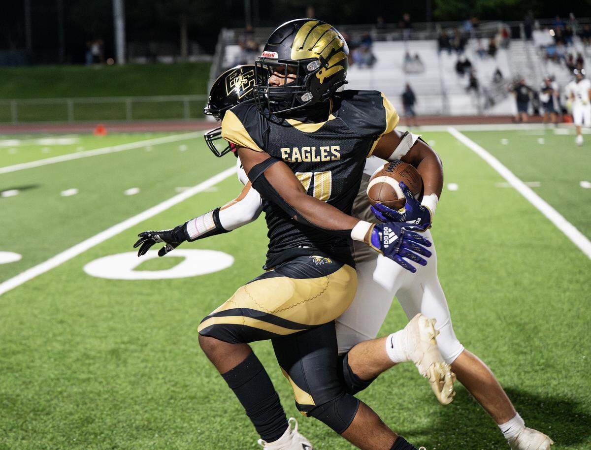 Enochs’ Aiden Muhammad fights for yardage along the sideline during the non-league game with Buhach Colony at Gregori High School in Modesto, Calif., Friday, Sept. 1, 2023.