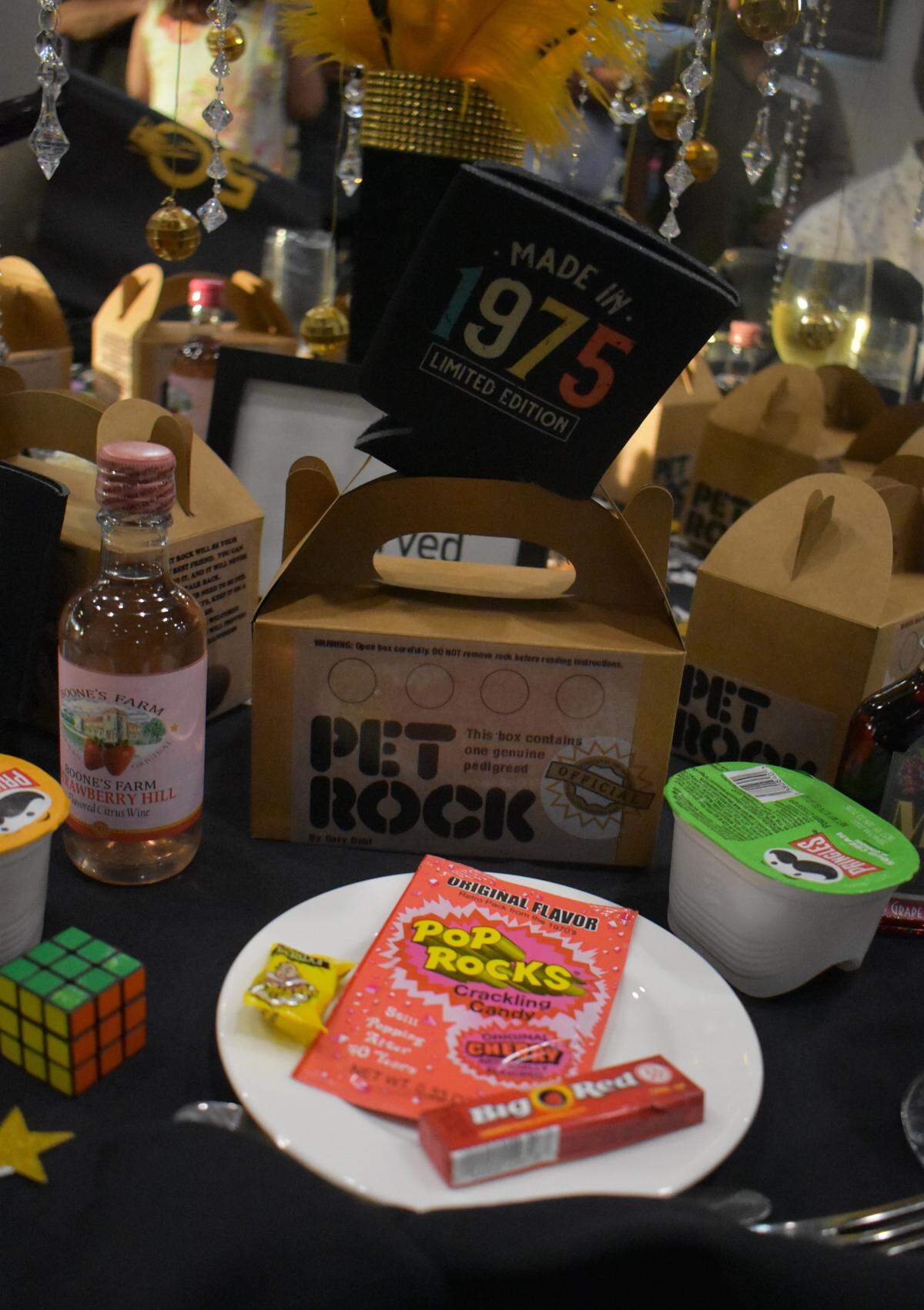 Themed products decorate tables at the Beyer High School Class of 1975’s 50-year reunion at Del Rio Country Club north of Modesto on Saturday, Sept. 13, 2025.