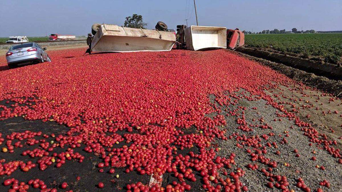 A big rig carrying tomatoes overturned this afternoon August 22, 2018 on Highway 33 at Gaffery Road south of Vernalis, Calif.