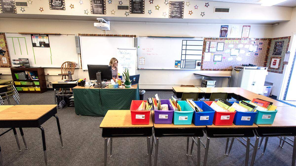 Fifth grade teacher Mary White talks with her students using a video conferencing app during the first day of distance learning at Fair Oaks Elementary School in Oakdale, Calif., on Thursday, August 6, 2020.
