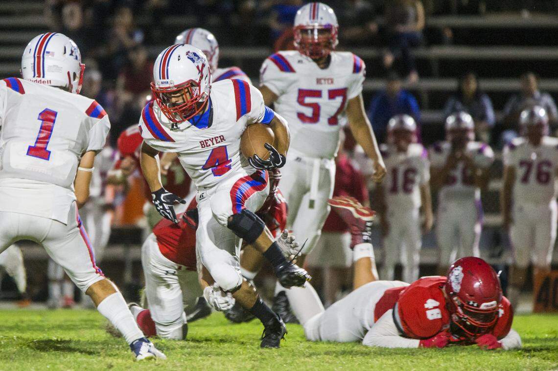 Gabe Ruiz, 4, works his way upfield with Ceres falling behind. Beyer took on Ceres High at Ceres, on Friday, Sept. 21, 2018.