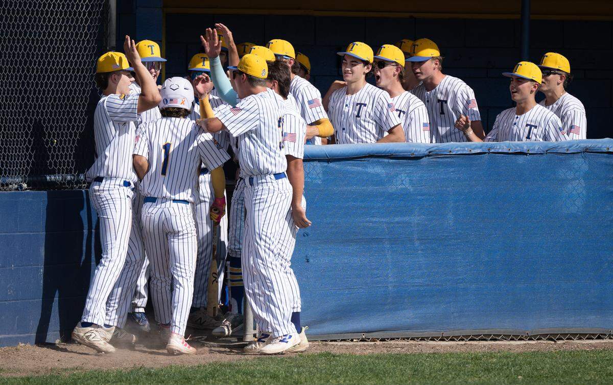 Turlock players celebrate a run scored by teammate Joshua Ramirez in the California Athletic League game with Pitman at Turlock High School in Turlock, Monday, April 14, 2025.