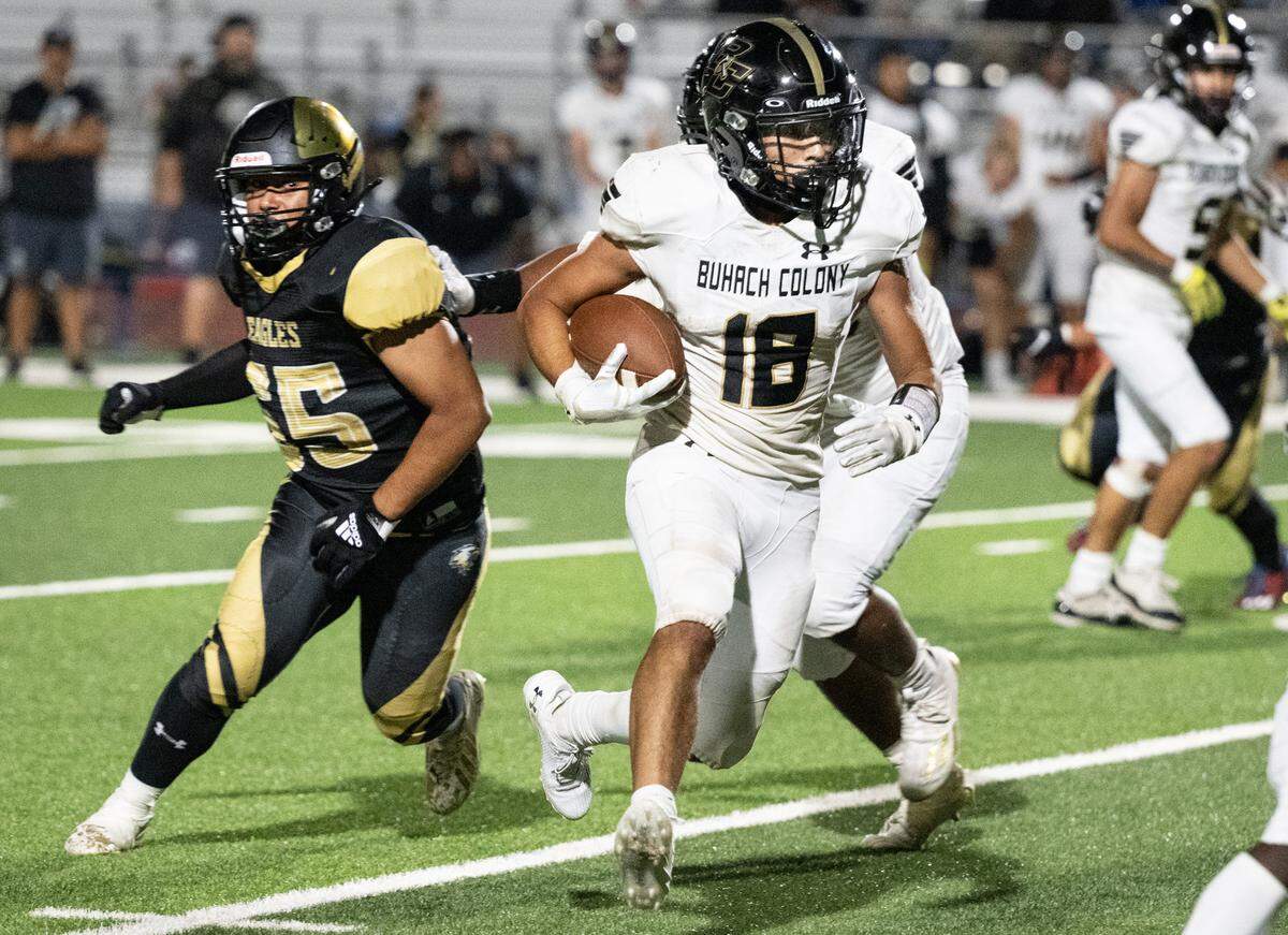 Buhach Colony’s Marcello J Avalos rushes for a gain during the non-league game with Enochs at Gregori High School in Modesto, Calif., Friday, Sept. 1, 2023.