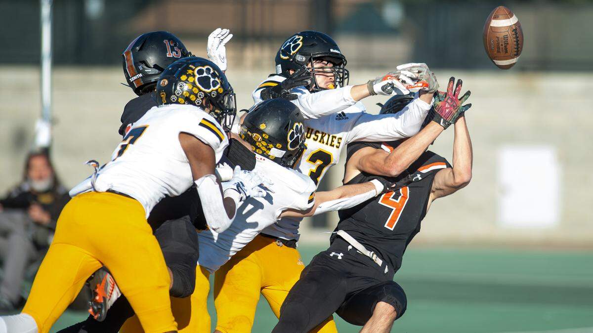 Hughson players break up a pass in the last seconds of the Sac-Joaquin Section Division VI championship game with Summerville at St. Mary’s High School in Stockton, Calif., Saturday, Nov. 26, 2022.
