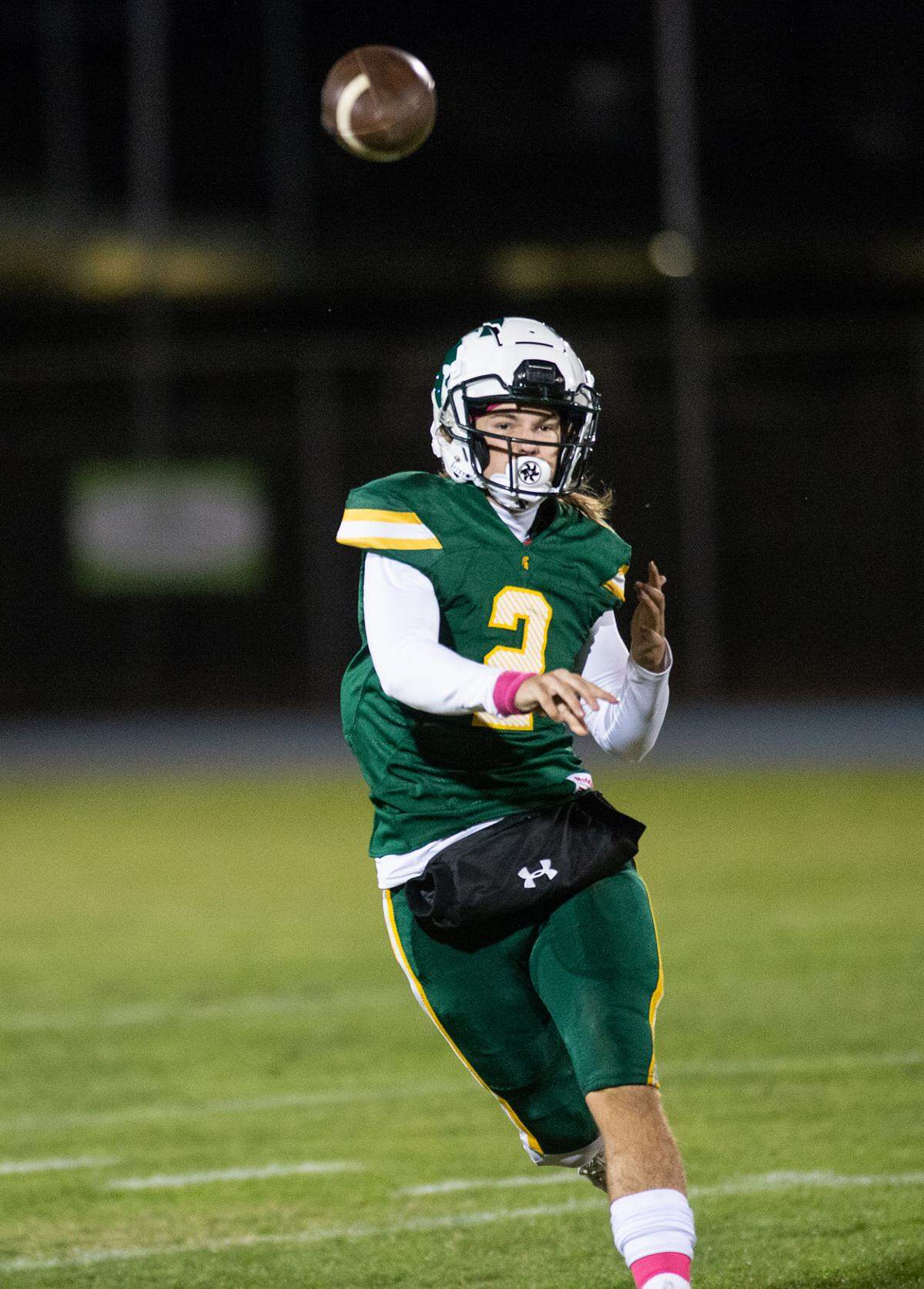Davis quarterback Jayson Munthe makes a pass during the Western Athletic Conference game with Lathrop at Modesto Junior College in Modesto, Calif., on Friday, Oct. 8, 2021. Davis won the game 25-13.