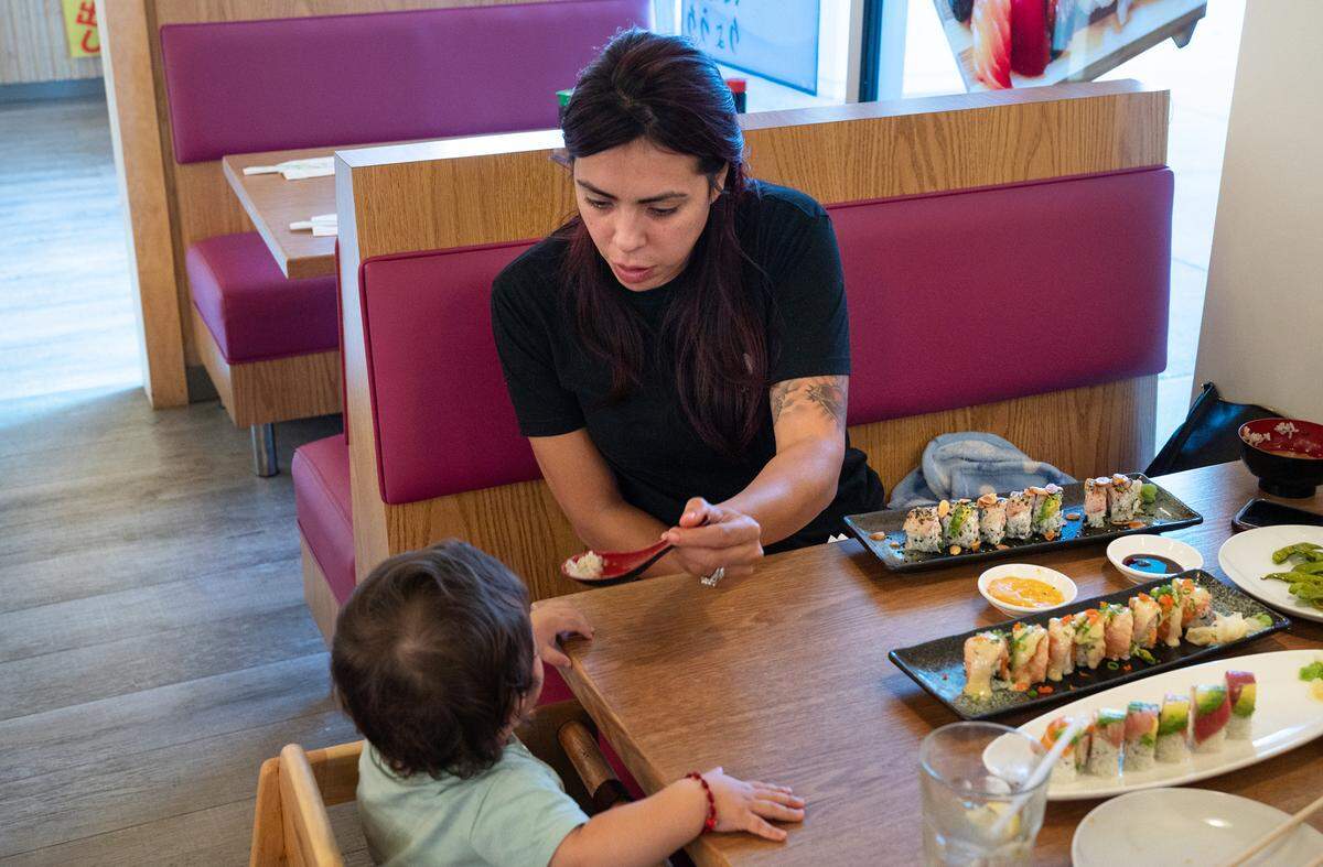 Lupe Munoz and her family eat at Okawa Sushi & Grill on Oakdale Road in Modesto, Calif., Thursday, September 29, 2022.