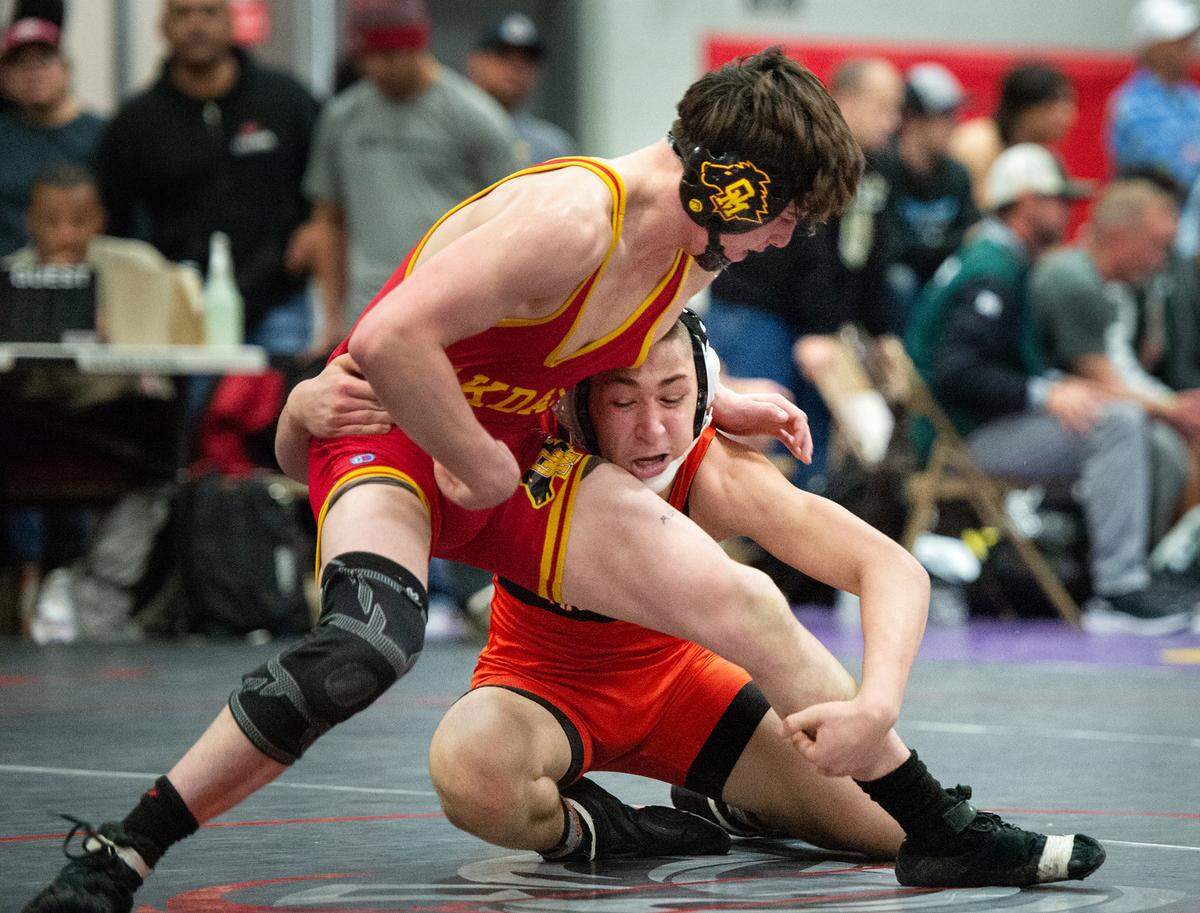 Oakdale’s Sam Neely battles Vacaville’s Isaac Padilla during the D1 Sac-Joaquin Section team dual wrestling championships at Lincoln High School in Stockton, Calif., Saturday, Jan. 28, 2023. Neely won the match.