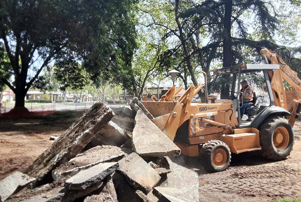 Workers were completing the demolition work Thursday, March 31, 2022, in Modesto’s Ralston Tower Park. It’s the first step in a $1.2 million makeover of the tiny park next to Ralston Tower, the low-income senior complex in downtown.