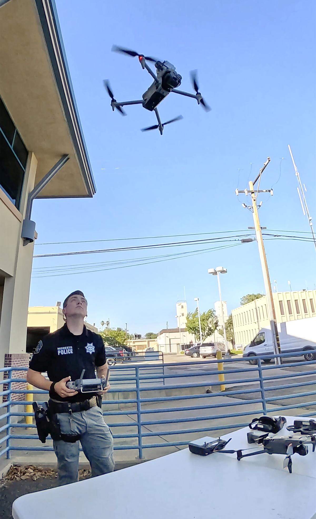 MPD officer Mason Lewis demonstrates the use of a drone equipped with a thermal camera and spotlight for flying night missions during an open house event at the Modesto Police Department in Modesto, Tuesday, May 19, 2026. The department’s unmanned aerial vehicles are categorized by the state as military equipment.