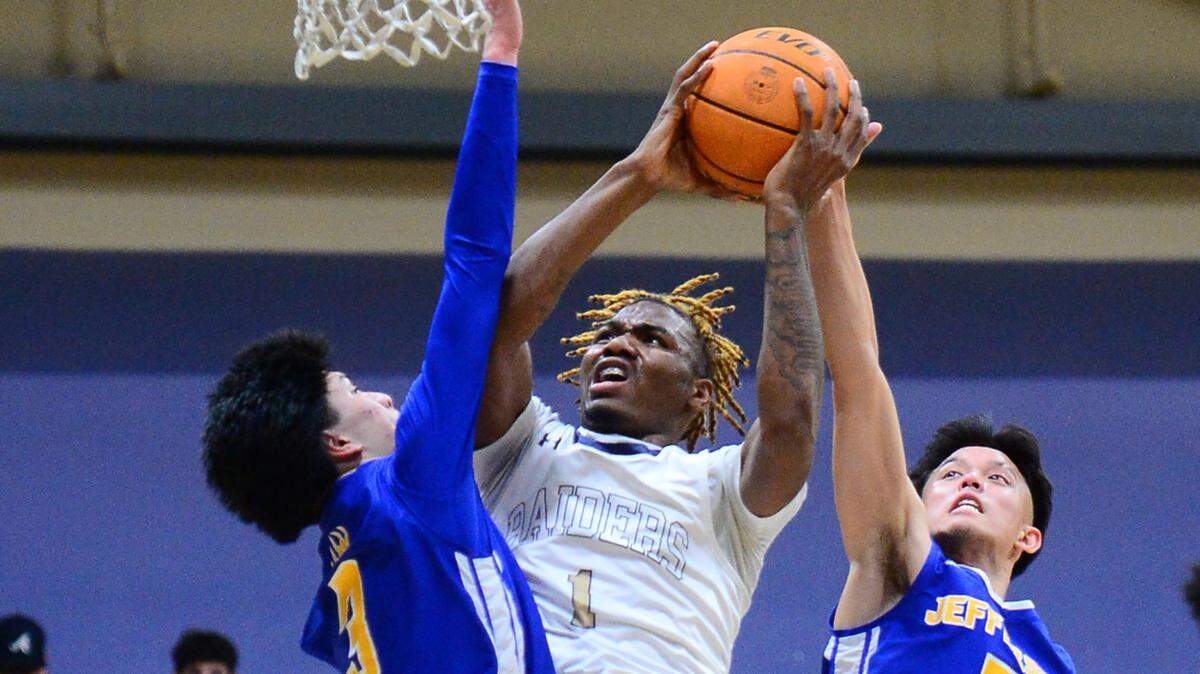 Central Catholic guard Malachi Miller shoots a contested layup during a CIF Northern California Division IV Regional playoff game on Tuesday, Feb. 28, 2023 in Modesto, Calif. The Raiders beat Jefferson of Daly City 71-51.