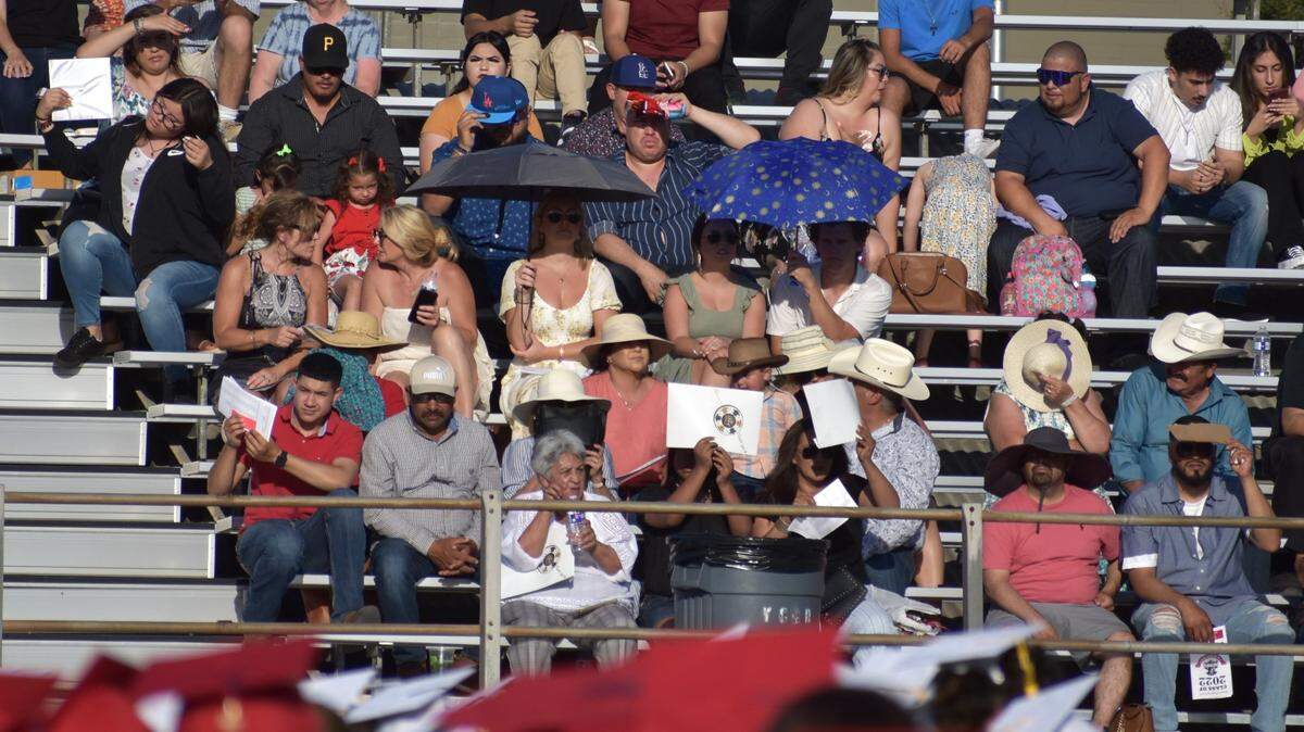 Big hats, big umbrellas and big drinks of water were among the ways audience members tried to beat the heat Wednesday afternoon and evening, May 26, 2022, at the Beyer High graduation ceremony at Modesto Junior College.