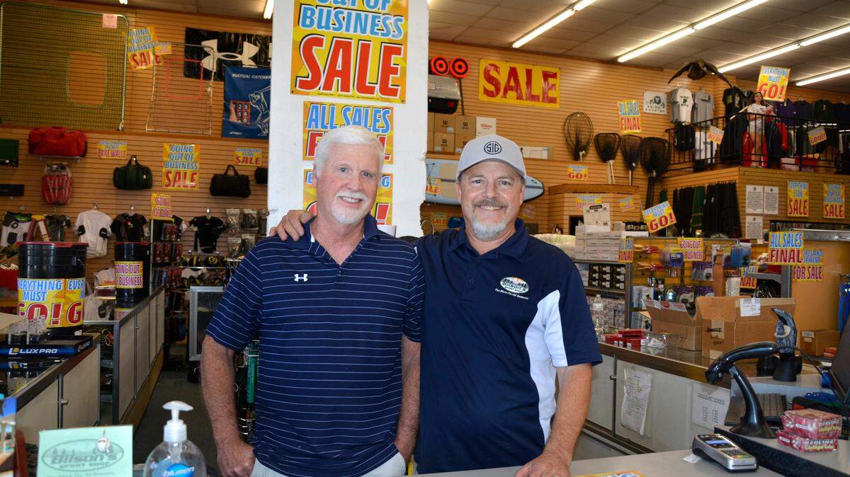 Bilson’s Sports Shop owners Steve Moe (left) and Brad Bilson inside their sporting and hunting goods store June 21, 2022 in Turlock, Calif.