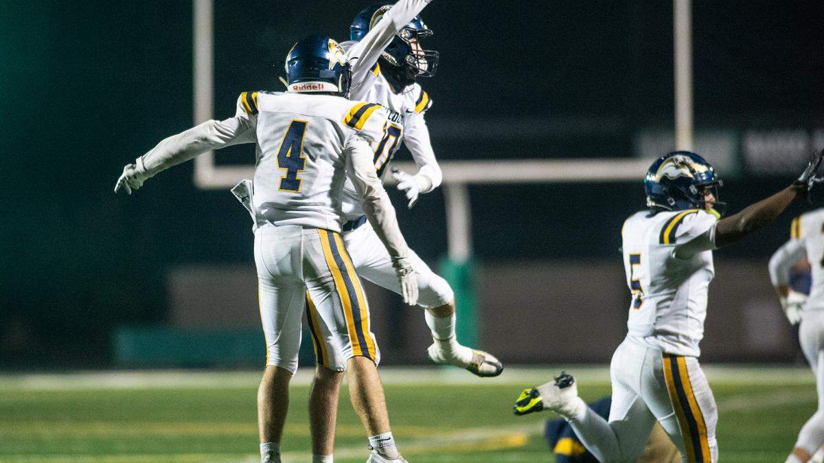 Turlock players Andrew Johnson, Peter Mello and J.T. Foreman II celebrate an interception to seal the 51-50 victory over St. Mary’s in the CIF Sac-Joaquin Section Division 1 playoff game at St. Mary’s High School in Stockton, Calif., Friday, Nov.11, 2022.