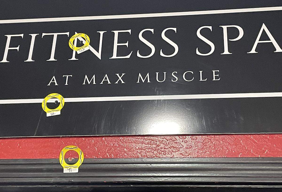 An interior door at Max Muscle Sports Performance in Modesto, Calif., had some of the bullet holes from a fatal police shooting of a suspect inside the store on March 17, 2025.