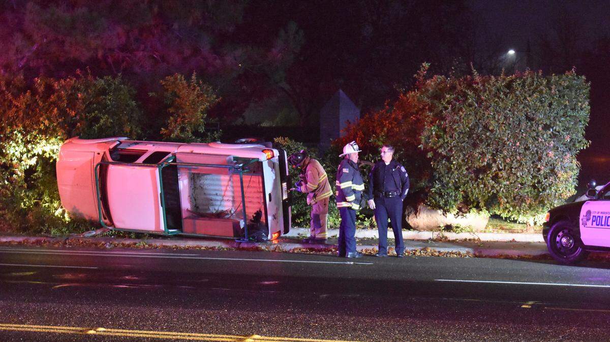 The Modesto police and fire departments and American Medical Response were dispatched to a single-vehicle rollover crash on Scenic Drive east of Bodem Street on Thursday morning, Jan. 4, 2017. The driver suffered minor injuries, and traffic into downtown backed up.