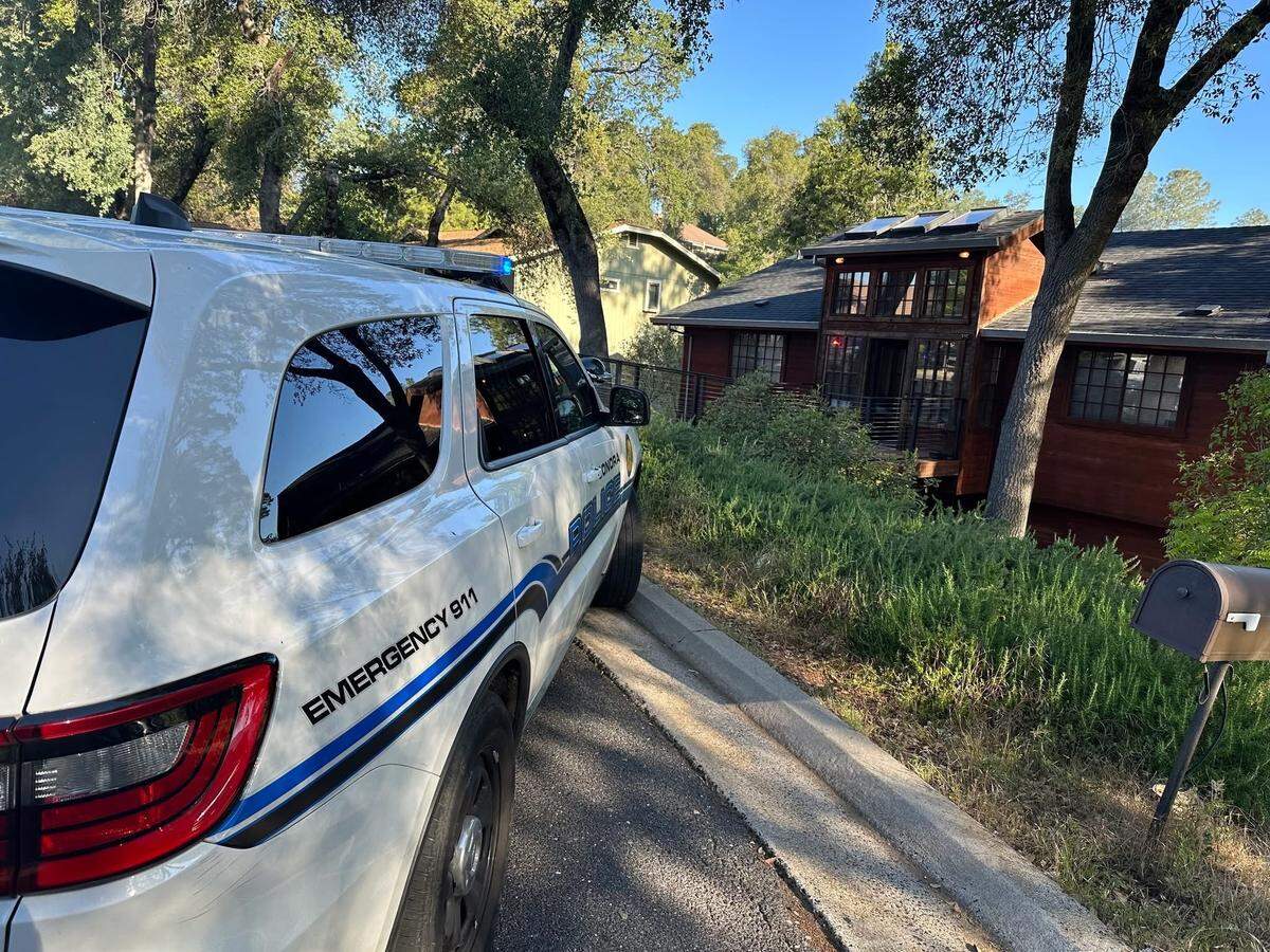 A Sonora Police Department vehicle is parked near a residence where officers served a search warrant as part of a child pornography investigation on April 29, 2026.