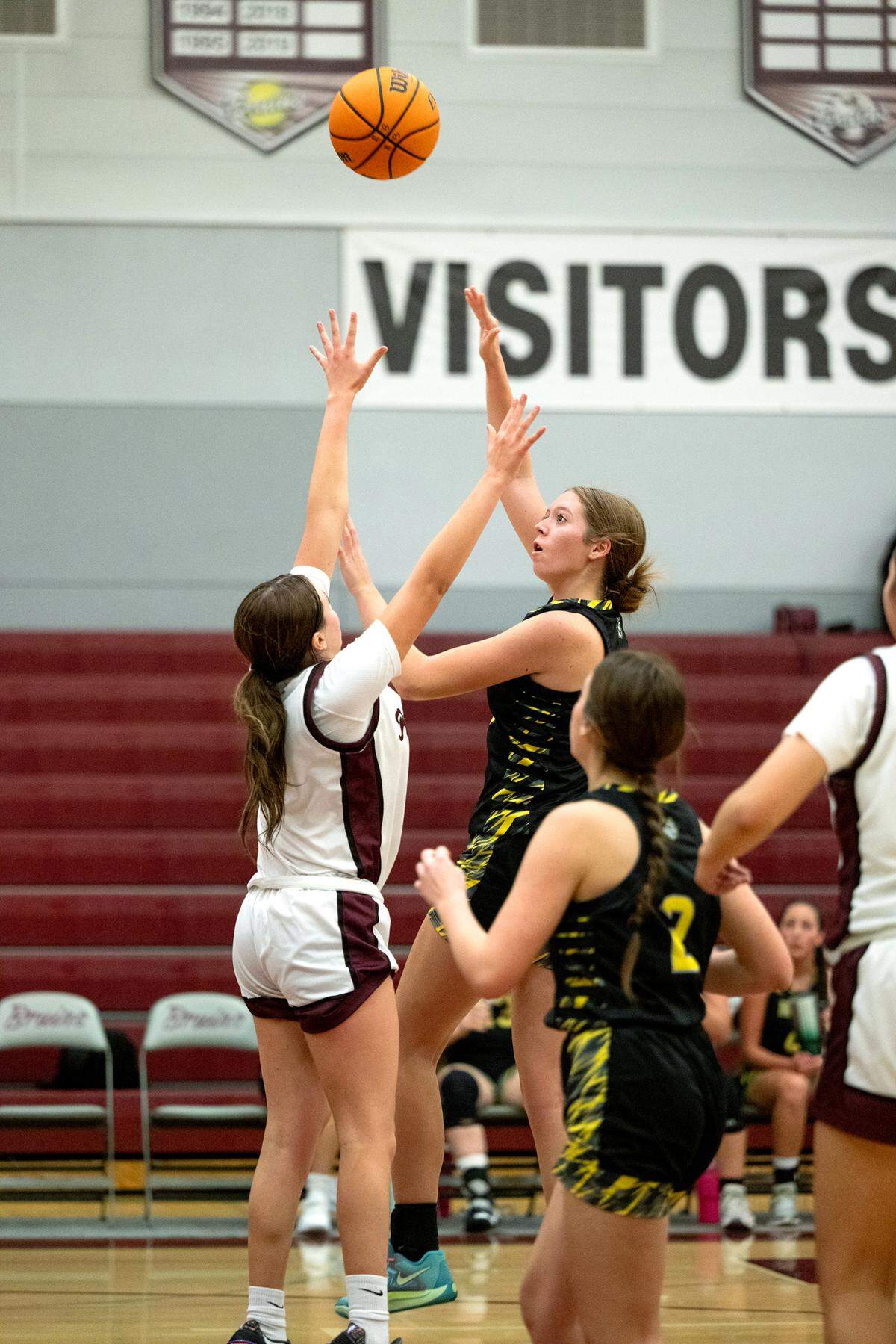 Hughson’s Leah Hobby attempts a shot over a Riverbank defender Ava Fuentes during a non-league game in Riverbank, Tuesday, Dec. 3, 2024.