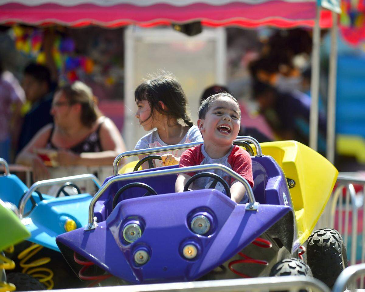 Erick Rodriguez, age 2, smiles while on a ride during the 2017 Stanislaus County Fair in Turlock.