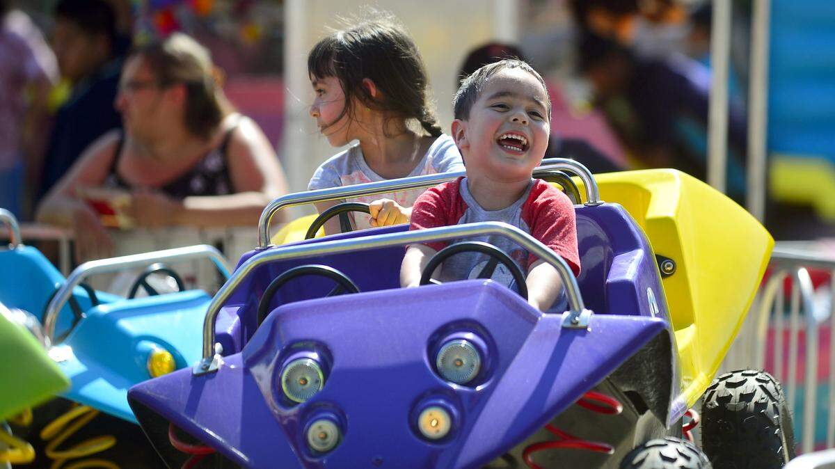 Erick Rodriguez, age 2, smiles while on a ride during the 2017 Stanislaus County Fair in Turlock.