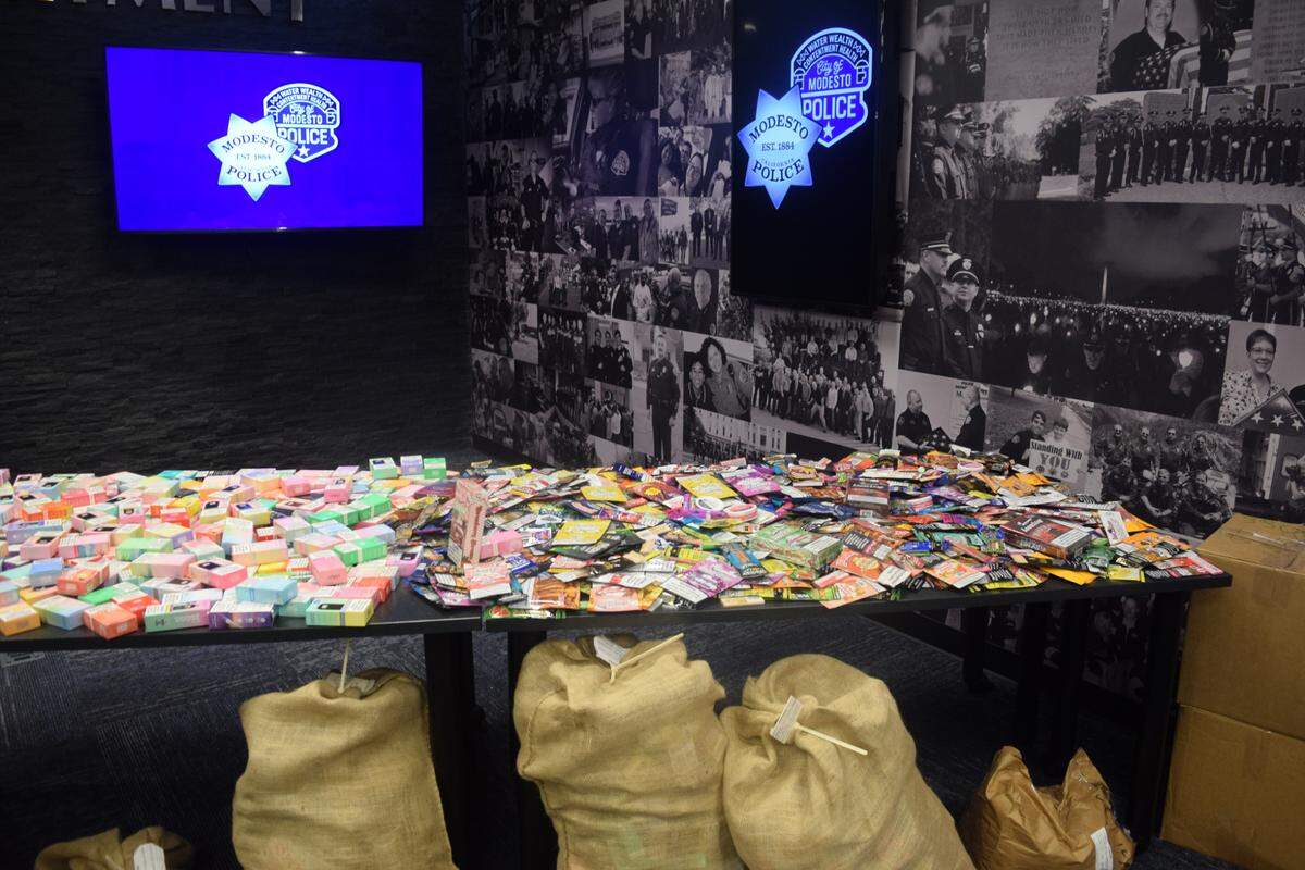 A table full of  flavored tobacco products, flavored vapes and meth pipes is displayed during a Modesto Police Department press conference at their police station downtown on Oct. 18, 2024. 