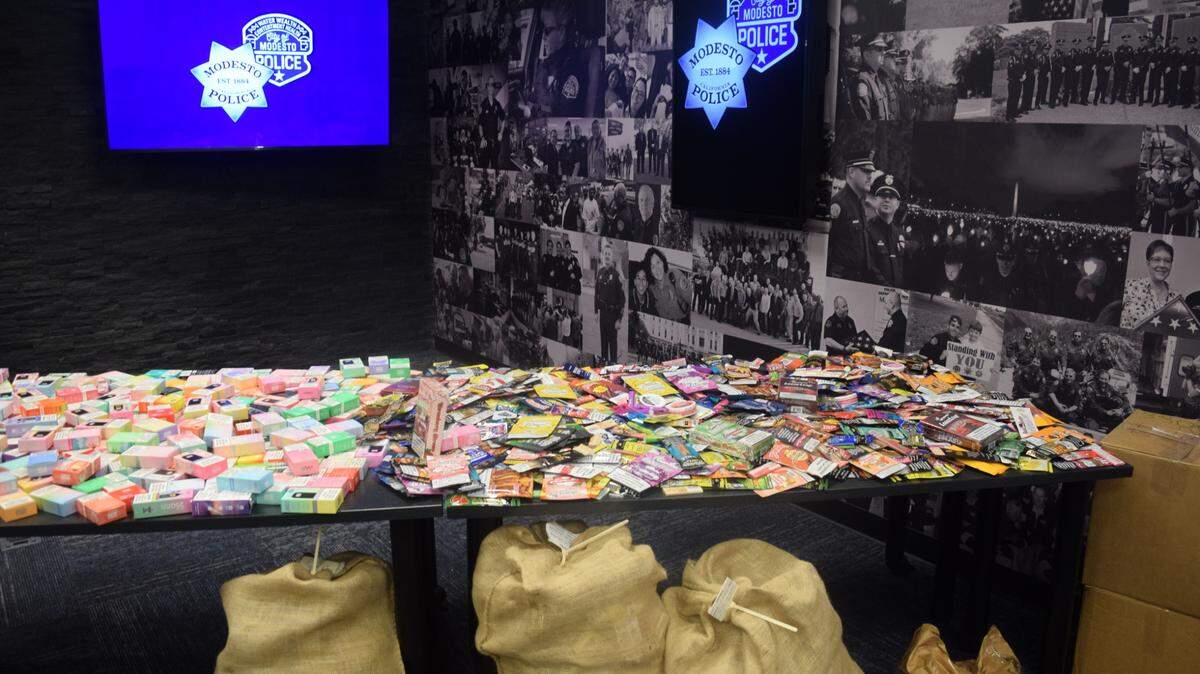 A table displaying flavored tobacco products, flavored vapes and meth pipes displayed during a Modesto Police Department press conference at their police station downtown on Oct. 18, 2024.