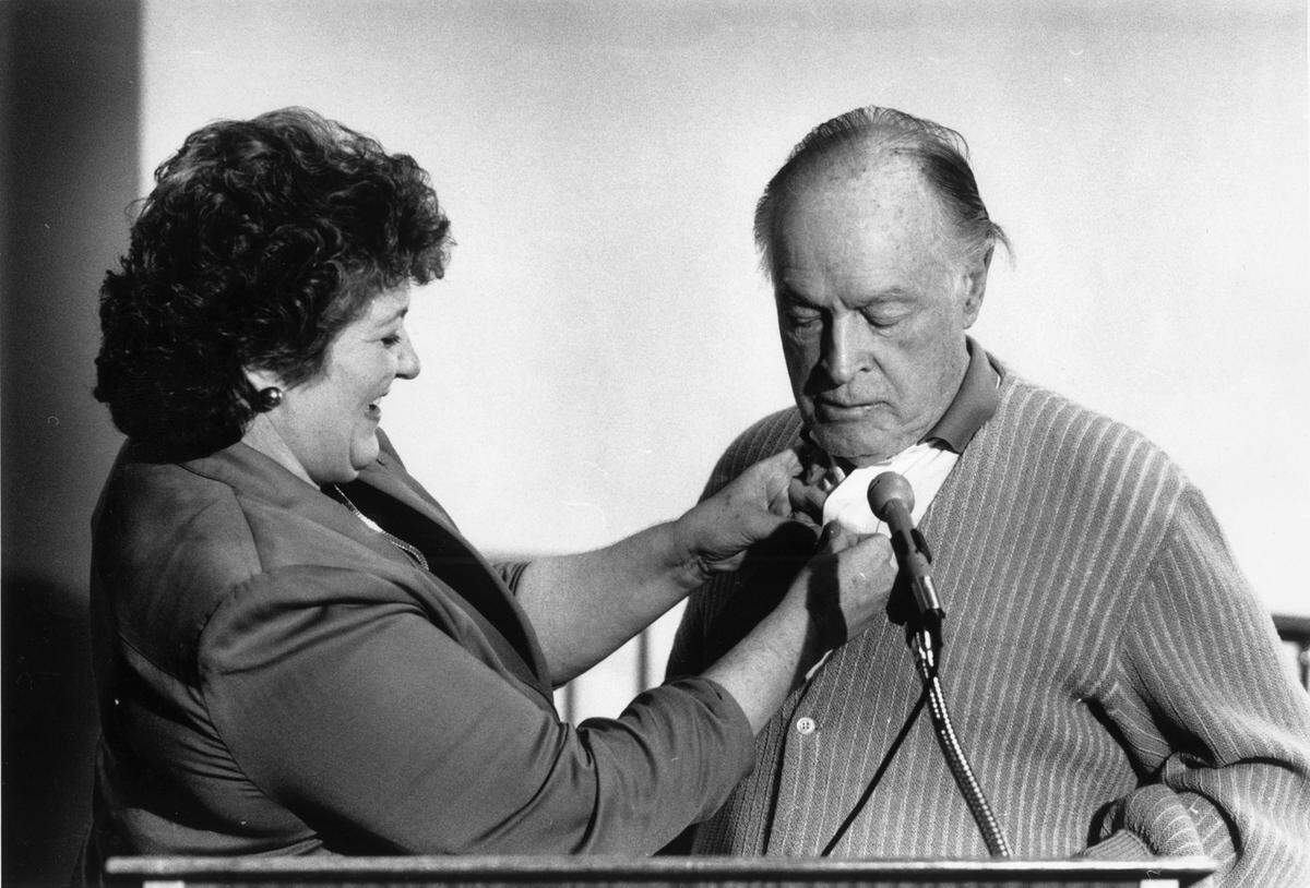March 12, 1988 Modesto Bee File Photo, Mayor Carol Whiteside pins a Centre Plaza Logo pin on Bob Hope. (Forrest G. Jackson Jr. / The Modesto Bee)