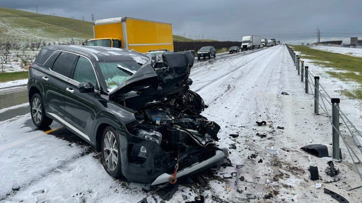 An SUV sits Wednesday March 10, 2021, on Interstate 5 after colliding with a flatbed pickup truck during a hail storm between Westley and Patterson. The California Highway Patrol responded to multiple spin-outs from the storm, Officer Tom Olsen said.