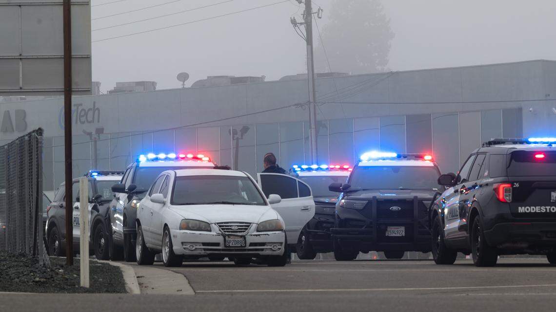 Modesto police officers conduct an investigation in Modesto, Calif., Sunday, Dec. 25, 2022.