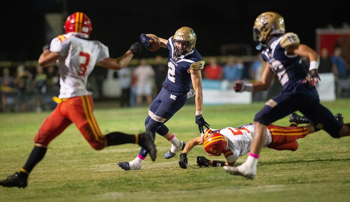 Central Catholic’s Tyler Jacklich runs the ball during the Valley Oak League game with Oakdale in Modesto, Calif., Friday, Oct. 14, 2022. Jacklich had 215 yards rushing on 18 carries and scored two touchdowns.