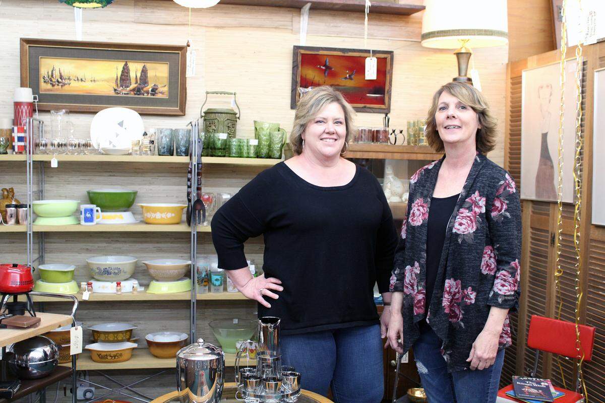 Main Street Antiques co-owners Jennifer Jensen, left, and Lori Smith, right, at their store in Turlock, Calif., on Tuesday, April 19, 2022. Smith said downtown Turlock businesses have been resilient during the COVID-19 pandemic.